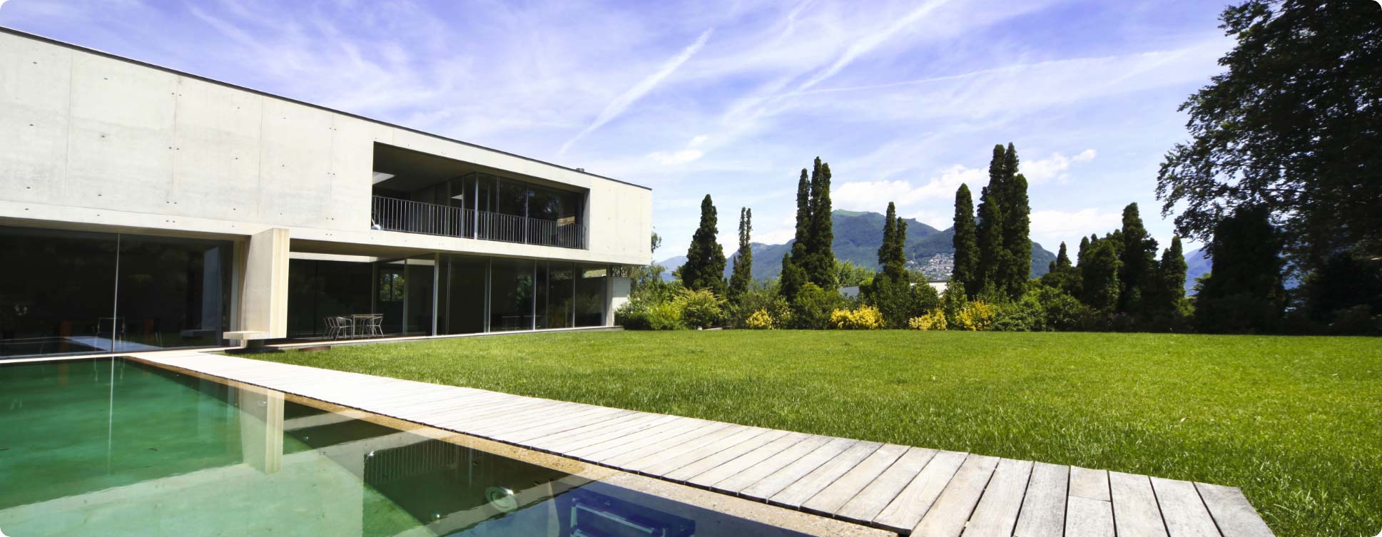 A house with a pool and a lawn